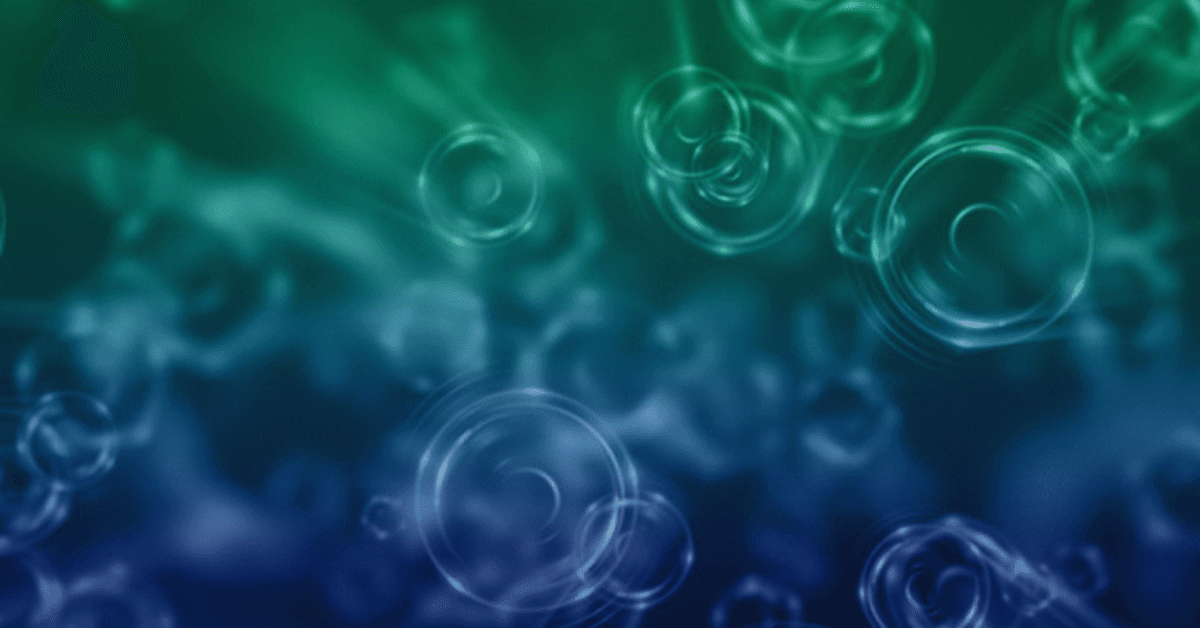 Abstract green and blue background with overlapping translucent circles and soft radial gradients.