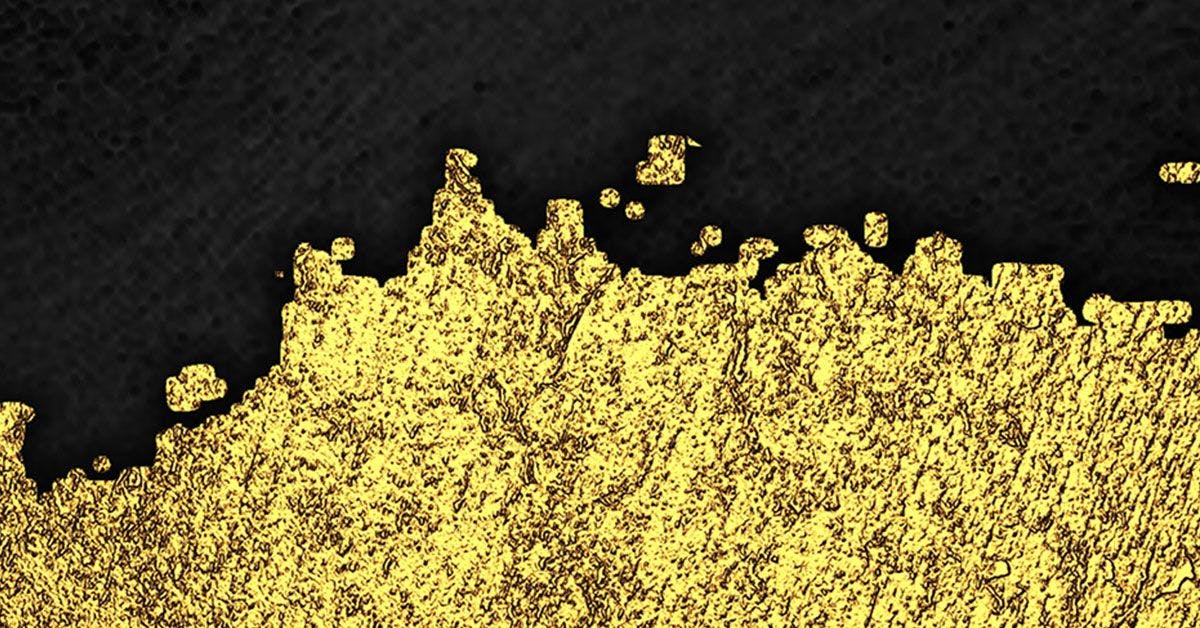An image of a gold paint on a black background.