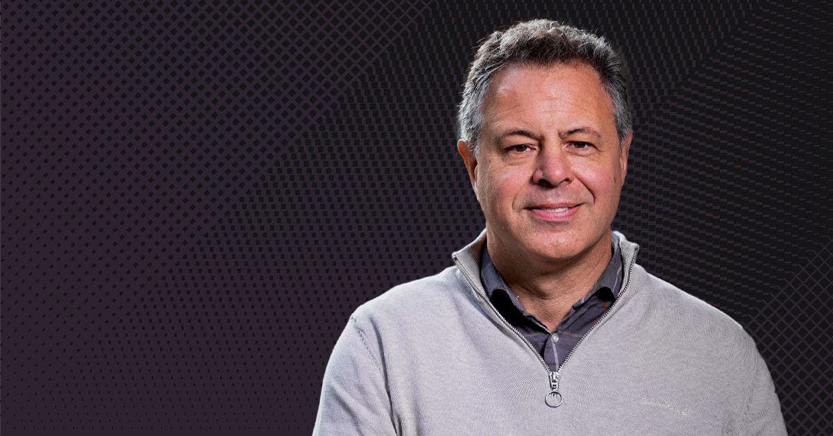 Headshot of Professor Ian Cousins on a dark background