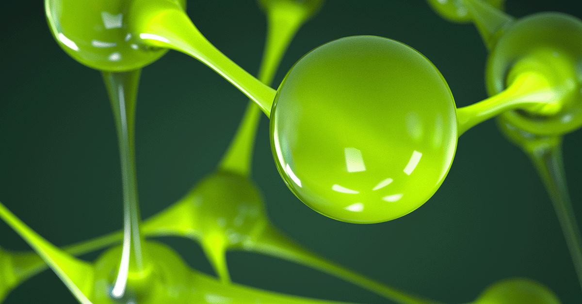 Green molecular structure with connected spheres against a dark green background.