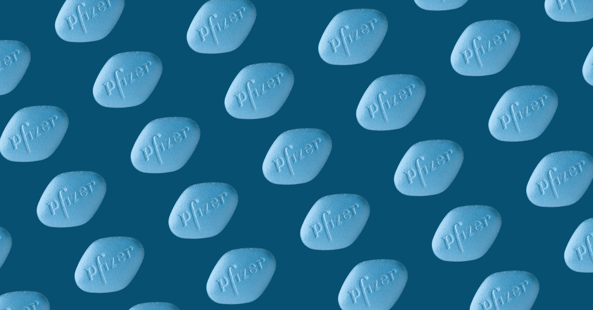 A pattern of blue, diamond-shaped Pfizer pills against a dark blue background. Each pill has the word "Pfizer" embossed on it.