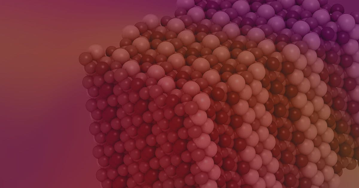 A 3D cube is composed of numerous colorful spheres arranged in a lattice structure, set against a gradient background of red to purple hues.