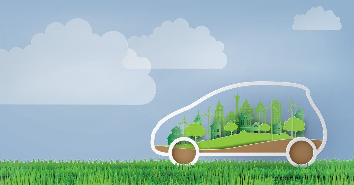 Illustration of a car outline with a cityscape, wind turbines, and greenery inside, set against a blue sky backdrop with clouds and grass at the bottom.