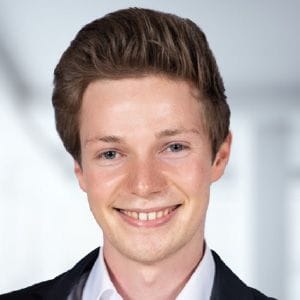 A headshot of Julian F. Baumgärtner