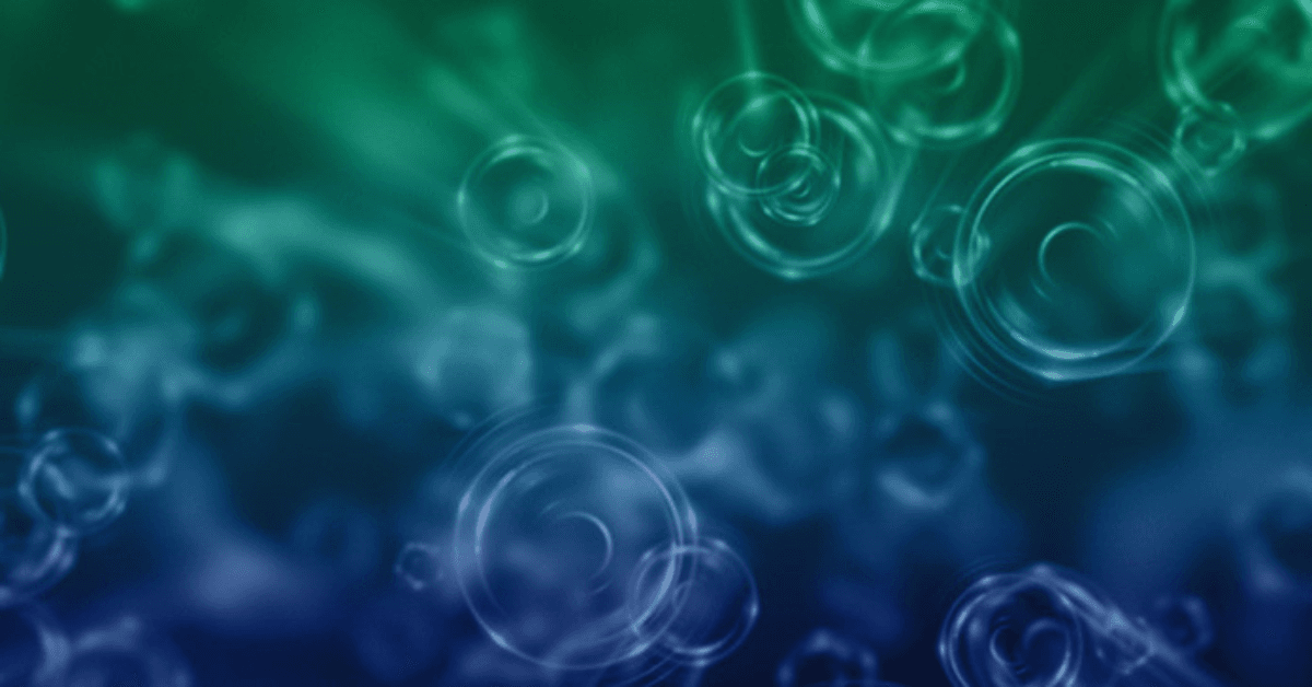 Abstract green and blue background with overlapping translucent circles and soft radial gradients.