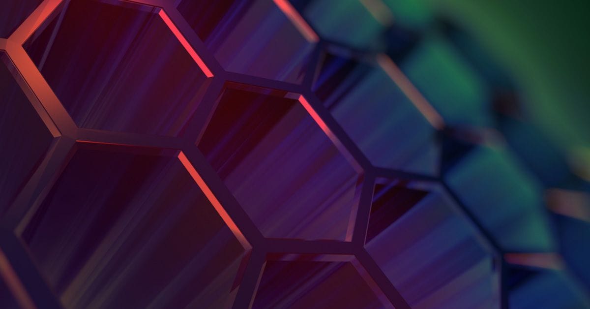 Abstract image of 3D hexagonal patterns with a gradient of red, purple, and green lighting.