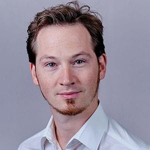 A headshot of Prof. Benedikt Warth