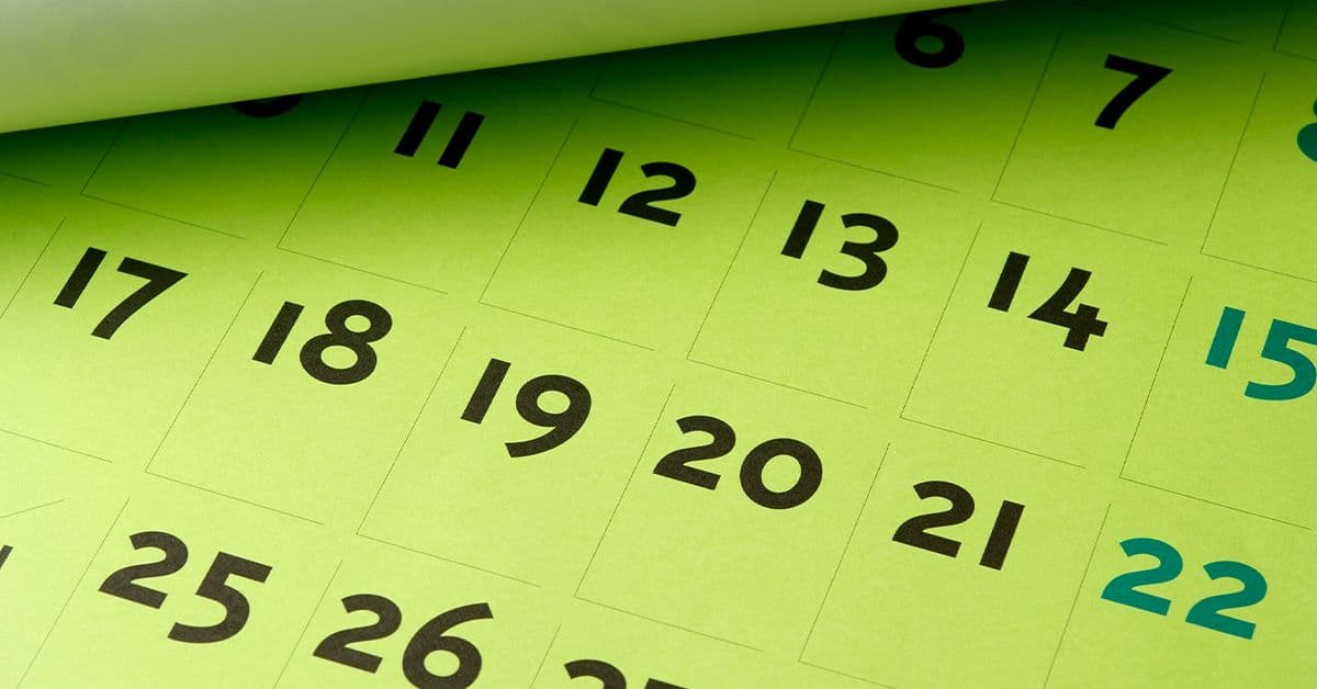 A monthly desk calendar in a vibrant shade of lime green