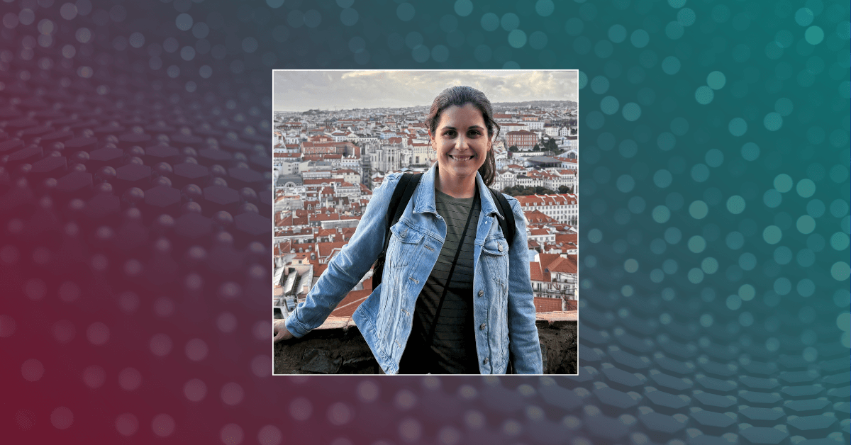 A headshot of Nicole Camasso against a textured gradient background featuring shades of red, purple, and teal.