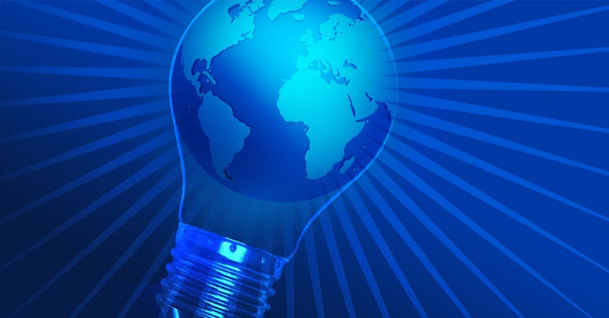 A light bulb with a globe inside of it on a blue background.