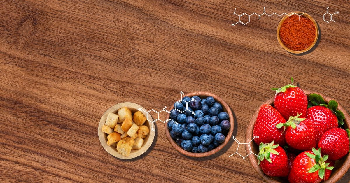 A bowl of berries, a bowl of nuts, and a bowl of berries on a wooden table.