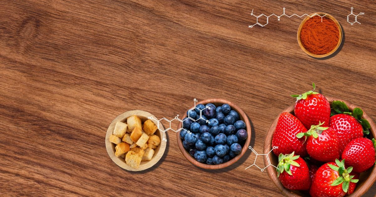 A bowl of berries, a bowl of nuts, and a bowl of berries on a wooden table.