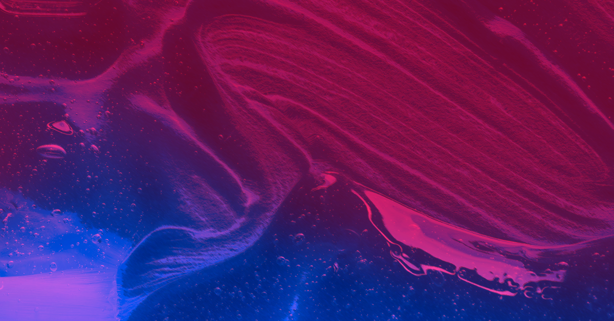 A close up of a red, blue, and purple liquid.