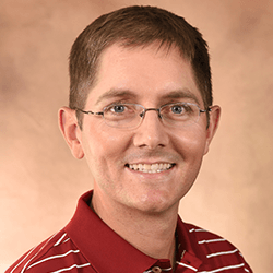 A headshot of Treavor Boyer