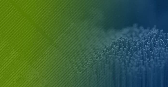 Abstract background featuring a gradient from blue to green with a textured pattern suggesting a close-up of fibers or bristles on the right side.