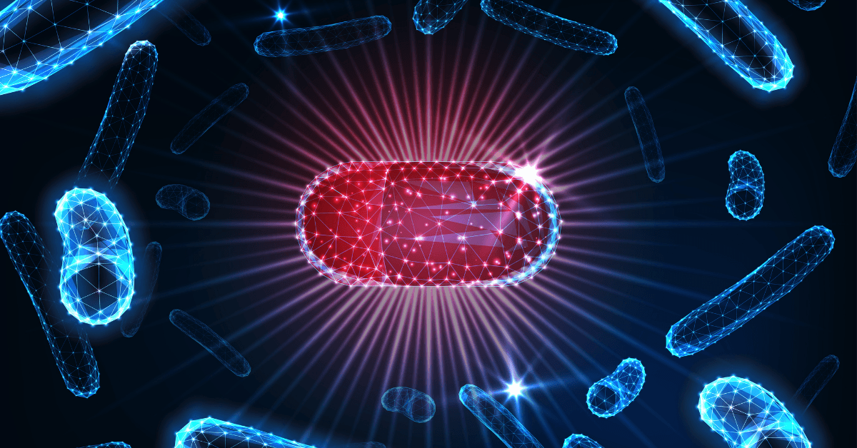 A glowing red capsule made of a digital wireframe is centered against a dark background with radiant light beams, surrounded by blue wireframe bacteria shapes floating around it.