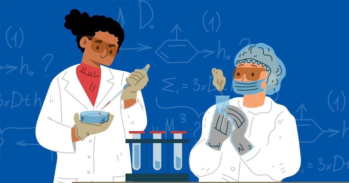 Two women in lab coats working on a project.