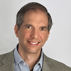 A headshot of Damian Helbling