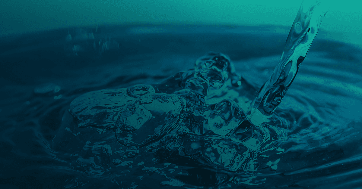 a close up of running water flowing down and splashing at the bottom of the image