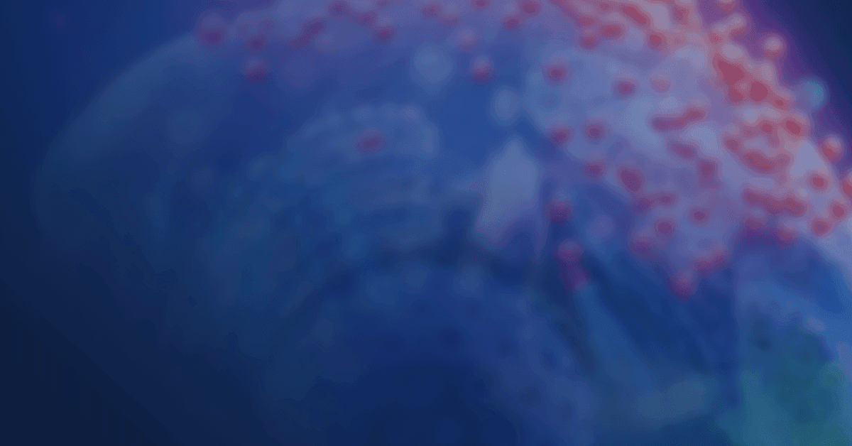 Abstract image featuring a blurry, close-up view of a cellular structure with red, spherical particles on a predominantly blue background.