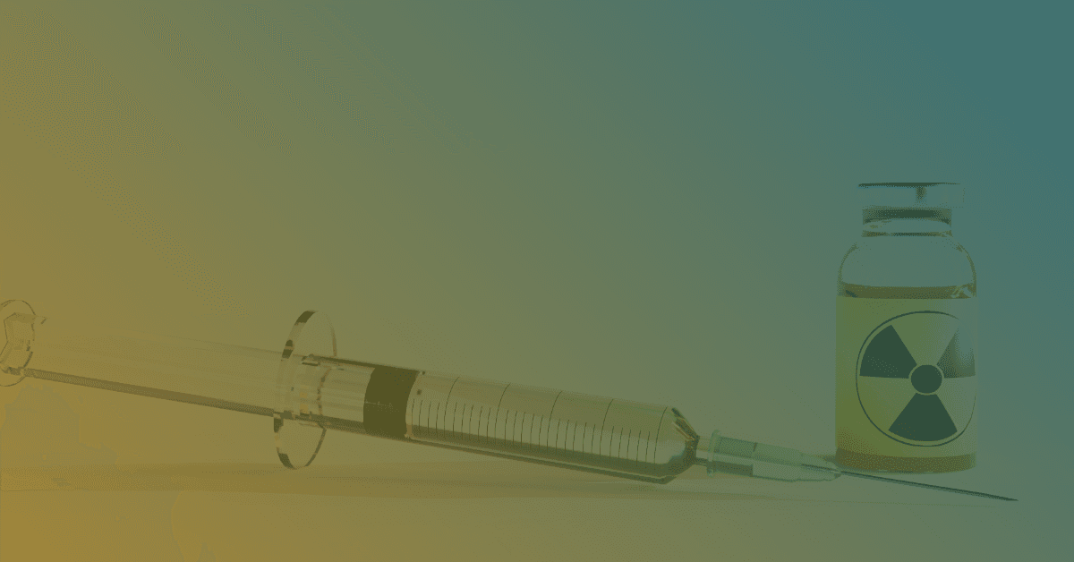 A syringe lies next to a vial labeled with a radiation symbol, set against a gradient background.