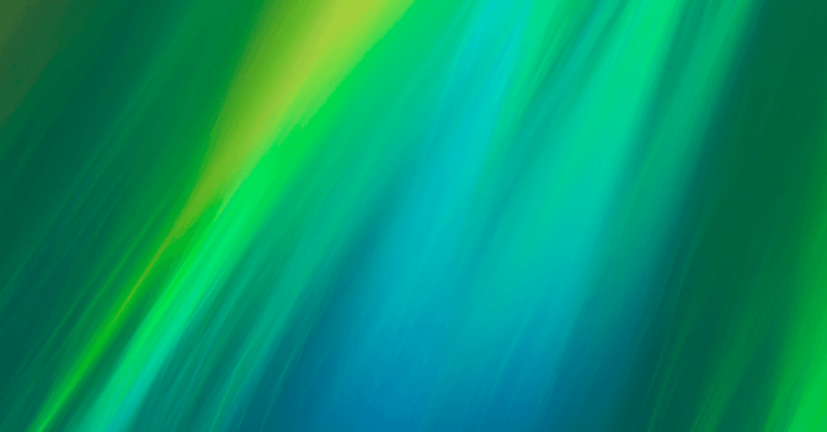 An abstract image with smooth, flowing streaks of green, yellow, and blue light blending together in a gradient, creating a soft, luminous background