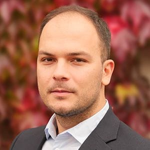 A headshot of Andi Alijagic