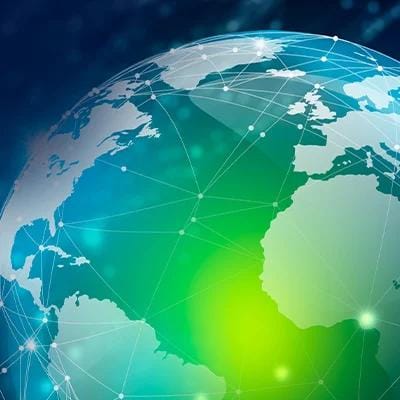 Digital representation of a global network overlaying a globe, emphasizing connectivity.