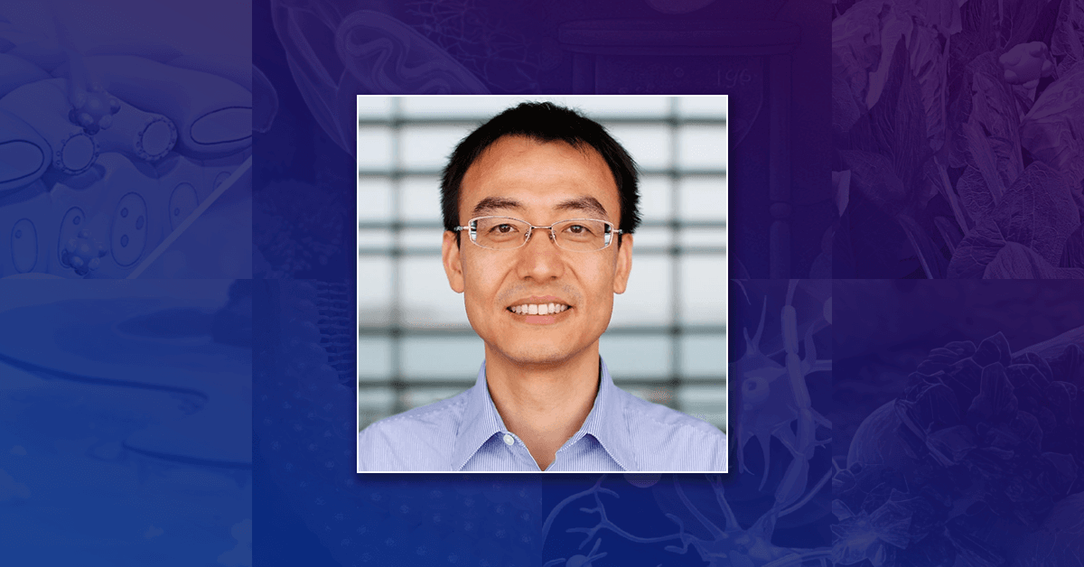 A headshot of Professor Wang Peng against a dark blue and purple background.