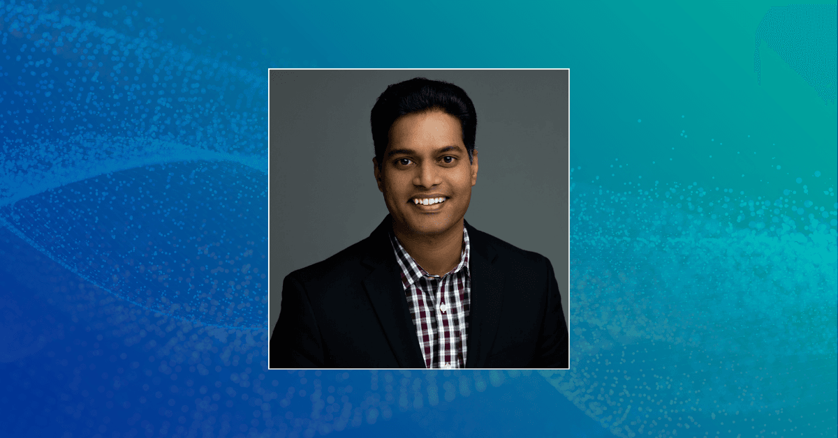 A headshot of Sai Konda against an abstract background in shades of deep blue and teal.