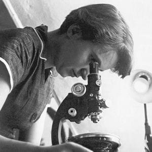 A photo of Rosalind Franklin with a microscope