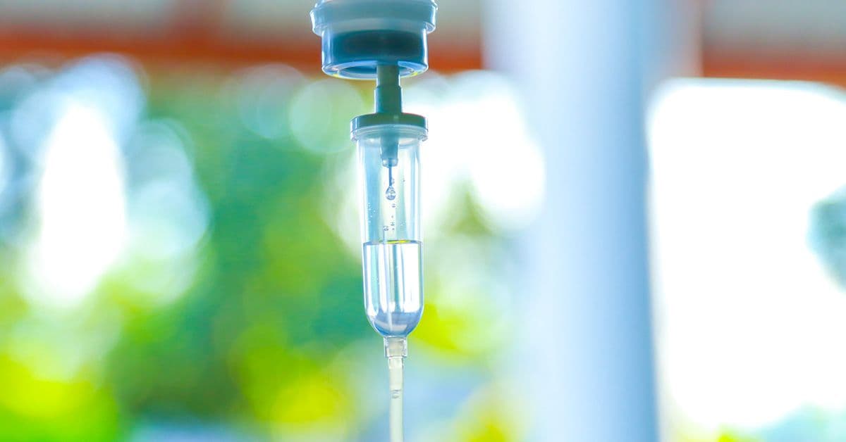 Set iv fluid intravenous drop saline drip hospital room,Medical Concept,treatment emergency and injection drug infusion care chemotherapy, concept.blue light background,selective focus