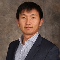 A headshot of Zhehui Jin