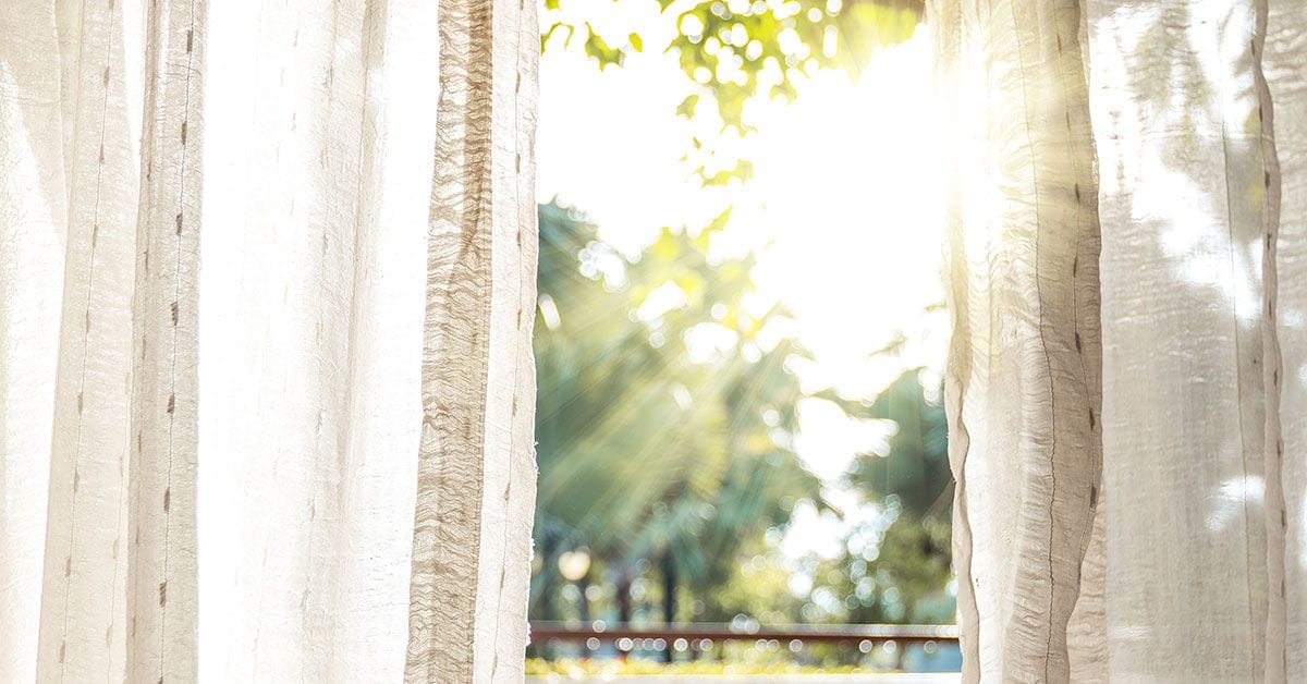 A white curtain with sunlight coming through it.
