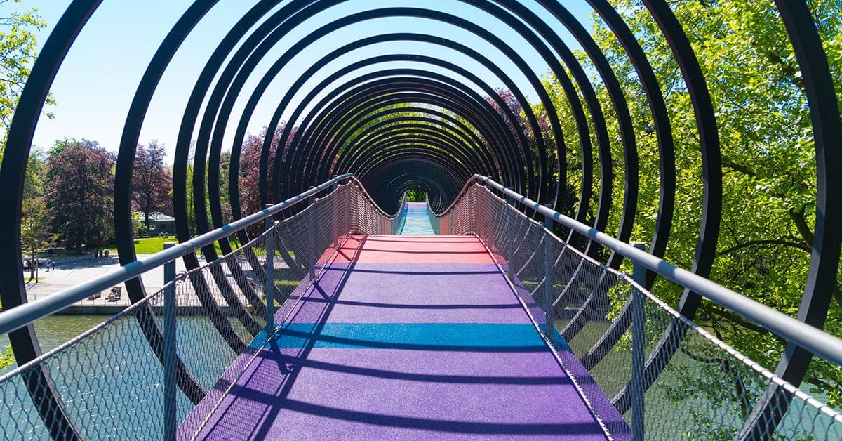 A circular walkway with a colorful carpet in the middle.