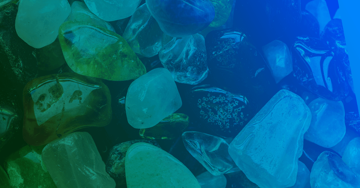 A Close up image of of a pile of green and blue "sea glass" rock