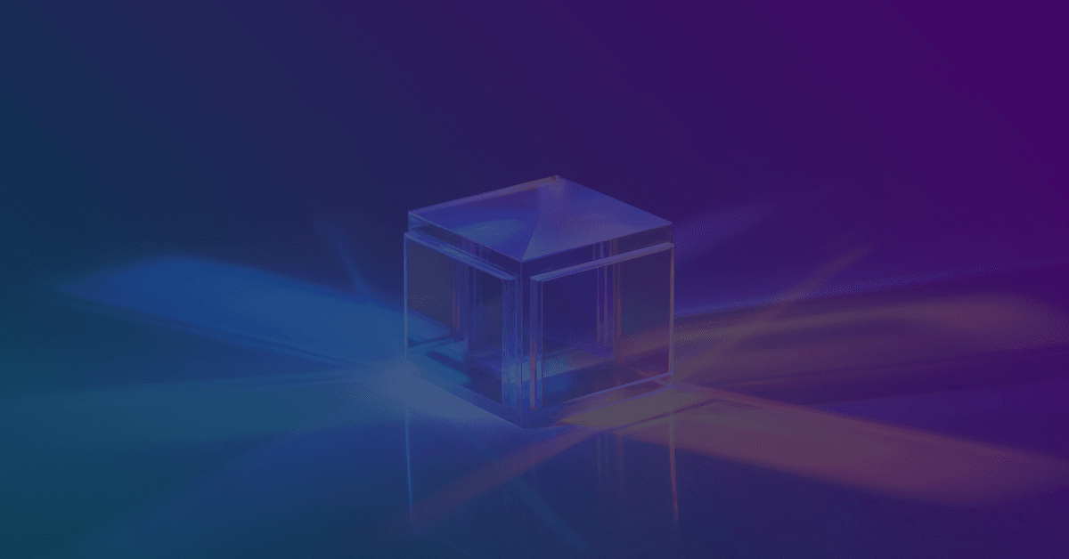 A translucent, cube-shaped object rests on a gradient blue and purple background, reflecting light in various hues.