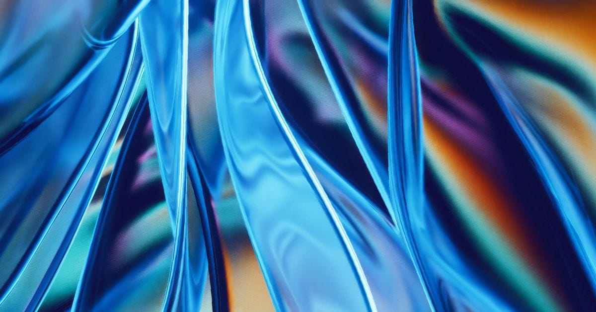 Abstract blue and purple swirled patterns with a glossy appearance.