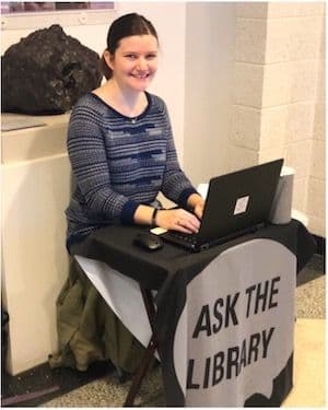 Alyssa Young sitting at a desk