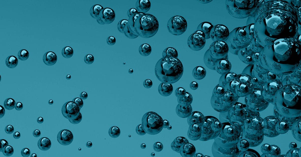 A cluster of transparent bubbles floating against a blue background.