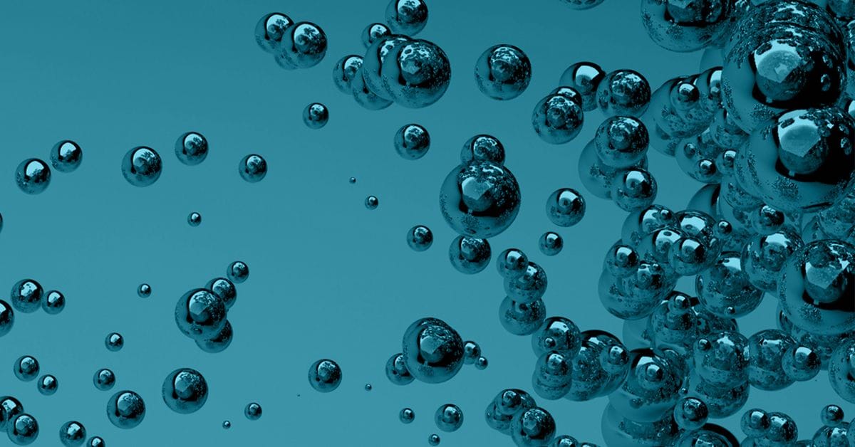 A cluster of transparent bubbles floating against a blue background.