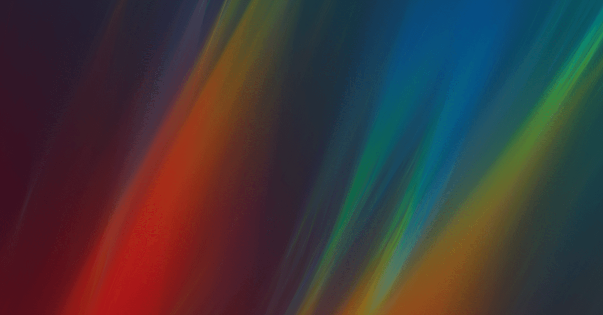An abstract image featuring vibrant, flowing colors of red, blue, green, and yellow against a dark background.