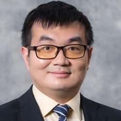 A headshot of Zhedong Zhang