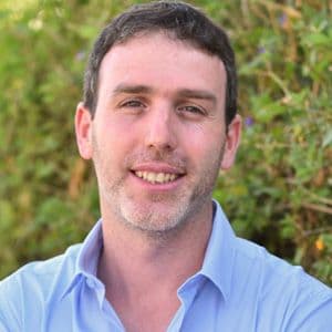 A headshot of Razi Epsztein