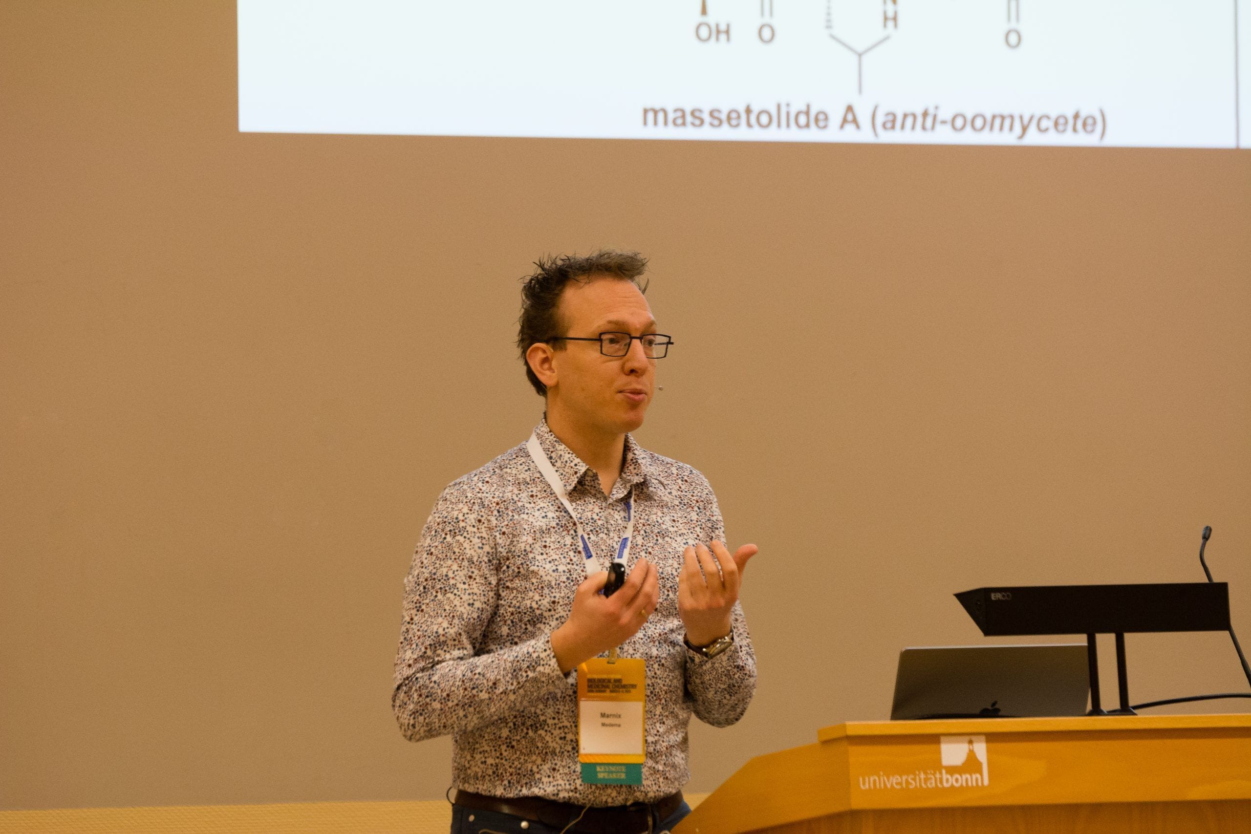 A speaker presenting at the Bonn Symposium