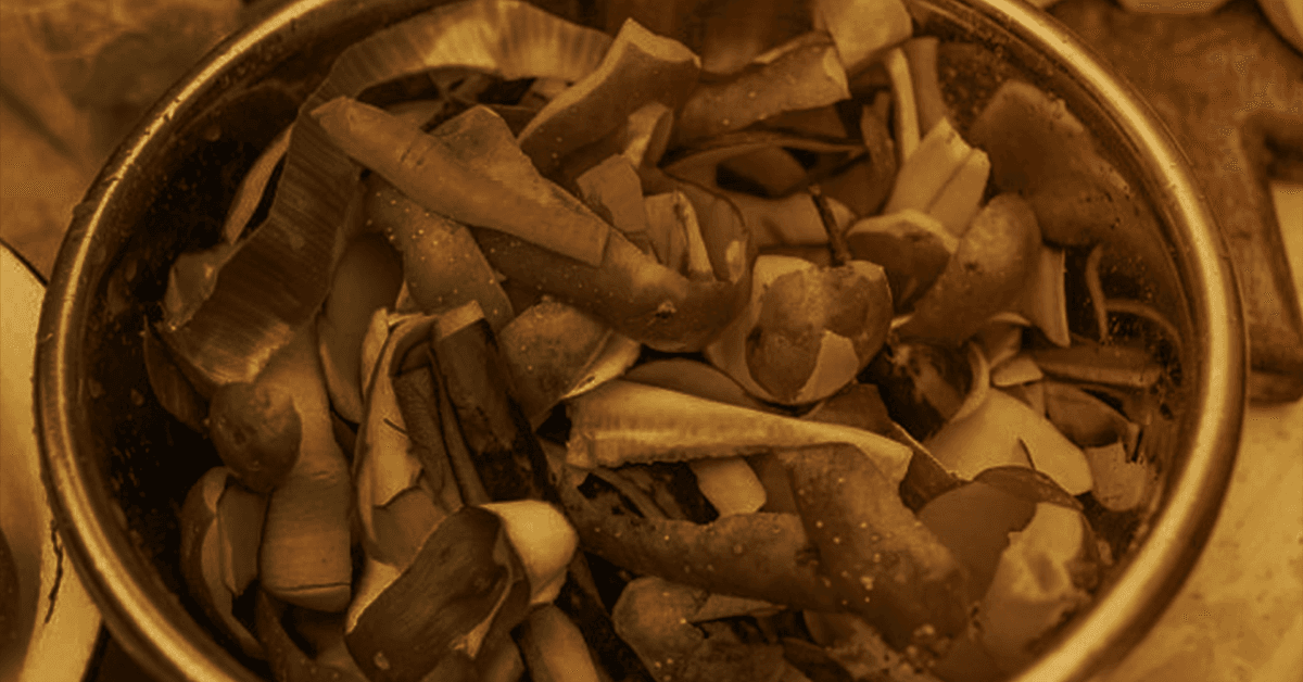 a bowl of produce peels and other food waste.
