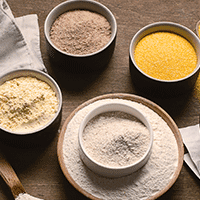 A selection of gluten-free flour alternatives in bowls
