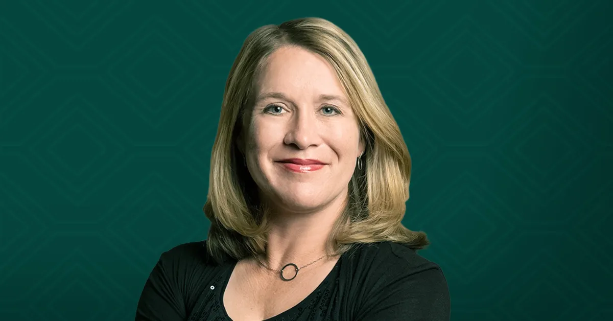 A headshot of Professor Christy L. Haynes against a dark green background