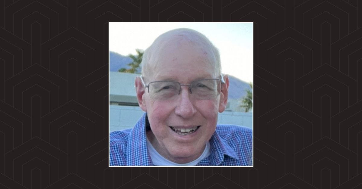 A headshot of Dr. Stanley P Sander against a black background.