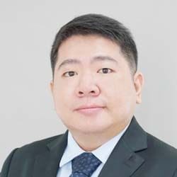 A headshot of Zhilong Zhang